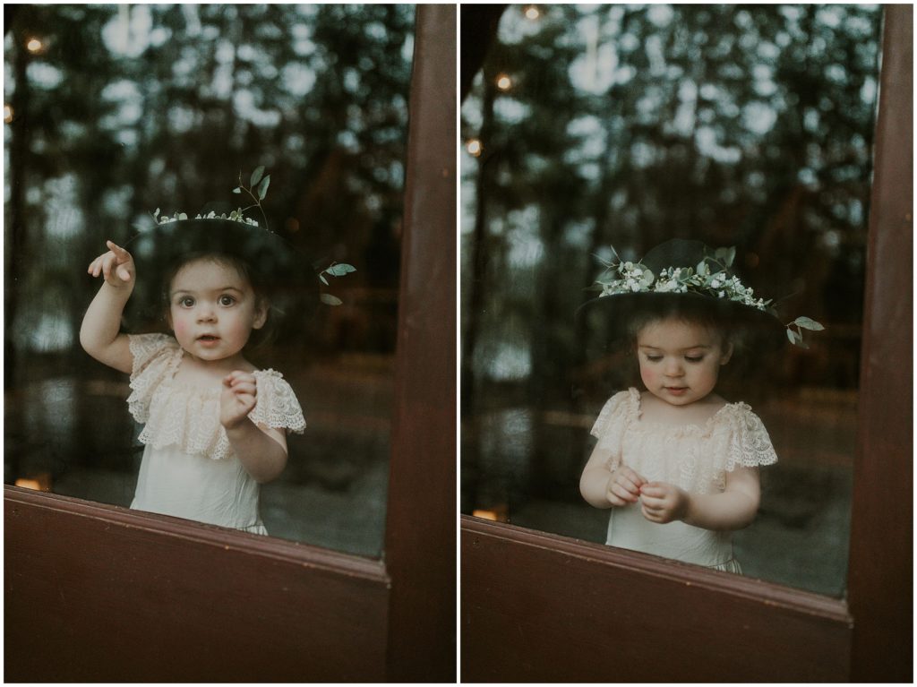child in window at wedding